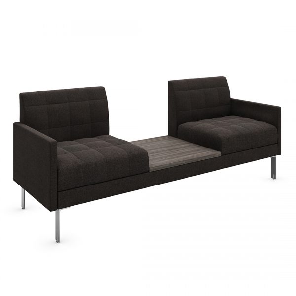 hemingway tufted sofa with armrests and a built in table